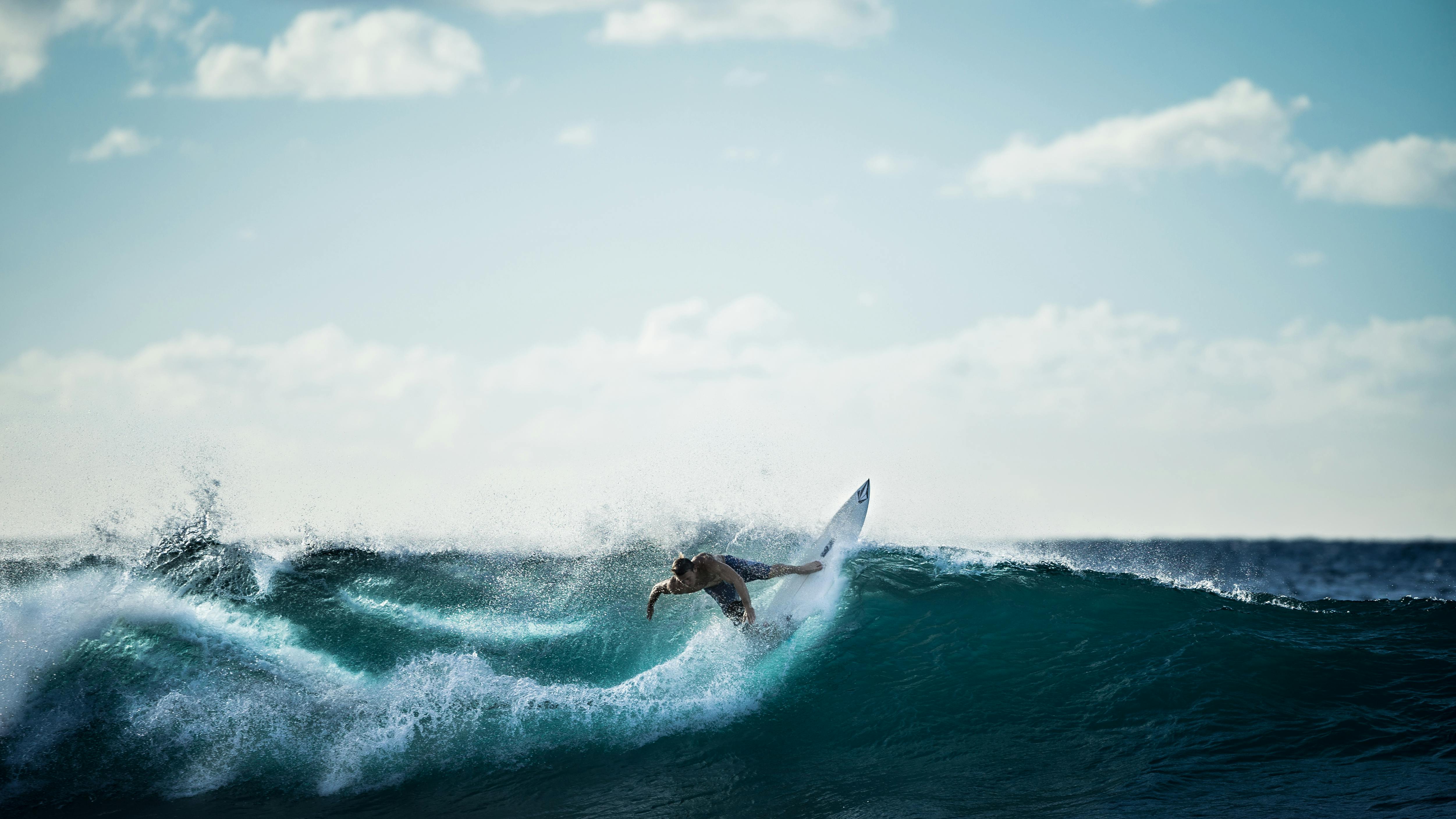 Surfer riding a massive wave